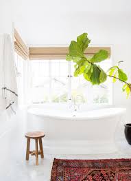 For more of a modern farmhouse aesthetic, outfit the space with light wood accents — like a pine vanity, stool or ceiling beam — as pure salt interiors did in this bright and fresh bathroom. 15 White Bathroom Ideas Decorating White Bathrooms