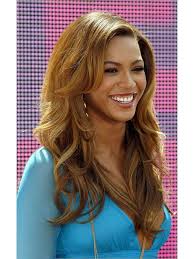 Her hair is soft, curly and blond with darker roots. Beyonce S Blonde Curly Long Hair Synthetic Fiber Wig