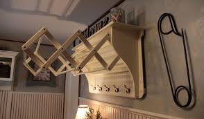 Wooden hanging clothes drying rack. Practical Laundry Rack Designs That Don T Stand Out