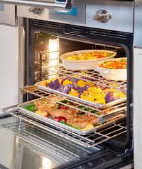 does a convection oven cook faster than conventional oven