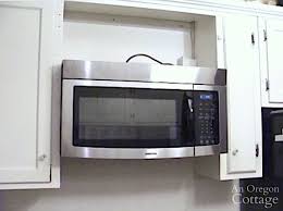 Kitchen wall cabinets are usually hung 18″ above countertops, 54″ above floor and 24″ above the stove. How To Retrofit A Cabinet For A Microwave An Oregon Cottage