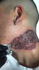 Life is a beautiful struggle is written on the inside of her right biceps: Whiteowl Tattoo Life Is A Beautiful Struggle Neck Tattoo