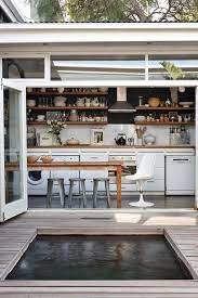 The flip out window allows you to connect your kitchen to your outdoor living space, which may include a bar, porch, deck or patio. 10 Mesmerizing Indoor Outdoor Kitchen For Summers