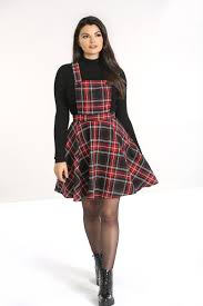 This dramatic layered top is sure to have you best dressed. Harvey Pinafore Dress
