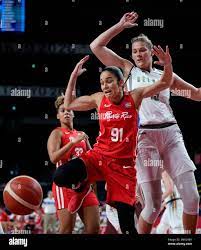 Puerto Rico's Michelle Gonzalez (91) looses the ball in front of Belgium's  Kyara Linskens (13), right, during women's basketball preliminary round  game at the 2020 Summer Olympics, Friday, July 30, 2021, in