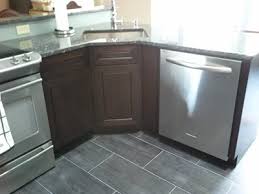 This base cabinet is designed specifically to hold a countertop with a sink arrangement and features four doors, two false drawers, and two working drawers. What Is Corner Sink Base Definition Of Corner Sink Base