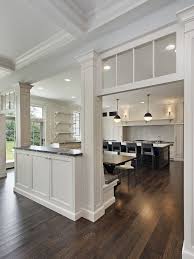 A half wall with top in an eclectic dining room and kitchen. Sallyl Oxford Development Elegant Traditional Kitchen Design With Transom Windows And Pass Traditional Kitchen Design Kitchen Pass Home