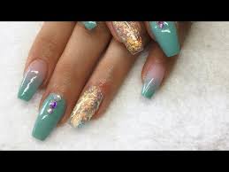 The bluish green represents the sweet characteristic, the deeper turquoise as if the sweetness had added to maturity.#summernails #nailsart #nailsdesign silver glitter. Mint Green Long Acrylic Nails With Holograpic Tips Vlog Nails Brittany Magazine