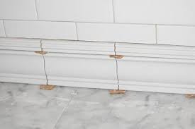 Nantucket 20 x 2 ceramic chair rail tile trim in beige. Tile Detail At Floor Using A Tile Chair Rail Molding And Liner To Make A Baseboard Bathroom Baseboard Tile Baseboard Bathroom Wall Tile