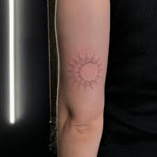Maybe you would like to learn more about one of these? Fine Line Sun And Moon Tattoo On The Tricep