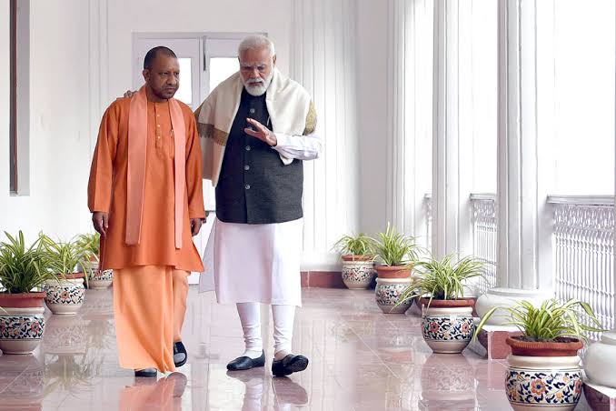 Yogi Adityanath shares photos of himself with PM Modi