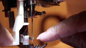 Watch for any thread to flap around. How To Use The Automatic Needle Threader On A Singer Sewing Machine 4166 Tutorial Youtube