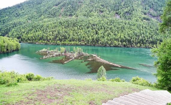 The renowned trio of bays on the Kanas River – Fairy Bay, Moon Bay and  Crouching Dragon Bay – is one of the prime attractions of the Kanas Scenic  Area in Altay,