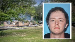 Escaped detainee killed in house fire during standoff, sheriff confirms