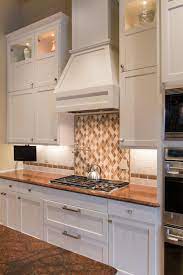 Our white shaker excels on both fronts. White Shaker Cabinets Range Hood In Transitional Kitchen Hgtv