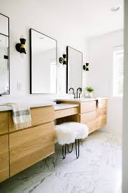 Juxtapose a variety of materials and finishes to create contrast in a minimalist bathroom. These Minimalist Bathroom Vanity Ideas Are Simple But Oh So Satisfying Hunker Master Bathroom Vanity Master Bathroom Vanity Ideas Minimalist Bathroom