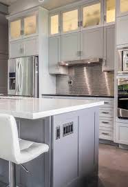 Cream Gray Cabinets Modern Design Stone Countertops Metallic Backsplash Stainless Appliances In 2020 Metallic Backsplash Cream Kitchen Cabinets Stone Countertops