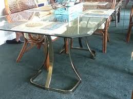 Floating in a sea of puffy brown carpeting. Glass And Brass Table From 1980s