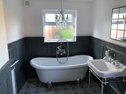 Pine ceiling beams and floors and an abundance of natural light offer sharp contrast to the deep navy blue walls in this cozy, rustic. Bathrooms The Wall Panelling Company