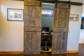 We just did a sliding barn door for our guest bedroom closet and i love the way it looks. Office Alcove With Sliding Barn Doors Transitional Home Office Other By Visionary Homes Inc Houzz