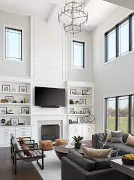 Double Height Family Room Built In Shelves Living Room High Ceiling Living Room Fireplace Built Ins