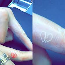 Ripped skin tattoo design bear paw @tattooivek. 11 Celebrity Broken Heart Tattoos Steal Her Style