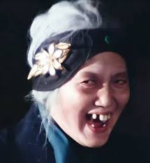 Can Anyone tell me what the Name of the Girl with the Glasses who is a  scientist and is expert in making poison. And often gets shipped with  Karma. I'm making a