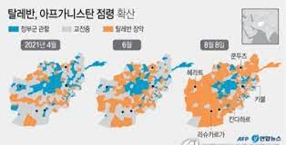 아프가니스탄 제2대 도시 칸다하르를 점령한 탈레반 반군 전사들이 13일(현지시간) 정부군 차량을 몰고 거리를 달리고 있다. K9oizgs Uxnaum