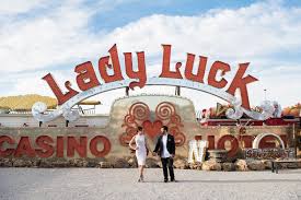 Neon museum las vegas wedding photo. Gina Carlos Neon Museum Downtown Las Vegas Engagement Photography Kristen Marie Weddings Portraits Las Vegas Wedding Photographer Family Portrait Photographer