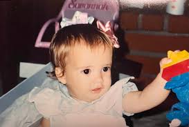 Twenty-one. I like the second photo because it captures her in a natural  moment and it's how I see her. I like the first photo because her smile  lights up my world.