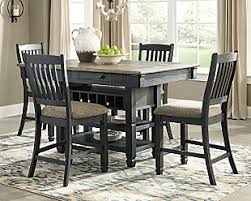 As a general rule of thumb, a fifth leg is added with the third leaf and so on. Tyler Creek Counter Height Dining Table And 4 Barstools Set Ashley Furniture Homestore