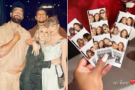 Taylor Swift wearing a strapless black midi dress during a dinner date with Travis Kelce