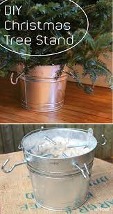 Using A Metal Pail And Clothesline Hooks Make This Farmhouse Style Christmas Tree Stand Christmas Tree Stand Diy Creative Christmas Trees Real Christmas Tree