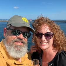 where to borrow a wheelchair for a tall and heavy person in Cave Creek area?