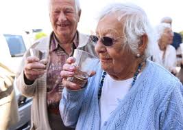 Rum glasses raised in toast to Nelson's return