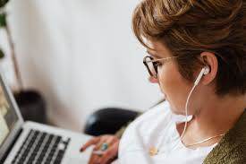 Instead of listening to music on spotify or itunes and other video sharing sites online, it lets you download music to your windows pc or mac computer so that you can enjoy listening to it wherever you are and whenever you want. Focused Woman Using Laptop And Listening To Music In Earphones Free Stock Photo