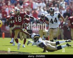 San Francisco 49ers' Fred Amey (18) celebrates a punt returned for a  touchdown against the St. Louis Rams at Monster Stadium in San Francisco