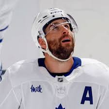 NHL players past and present react to shocking Brad Marchand trade.