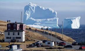 An iceberg is a large piece of freshwater ice that has broken off from a glacier or ice shelf and is floating in open water. Cold Snap Massive Iceberg Just Off Coast Draws Canadians Eager For Close Up Canada The Guardian