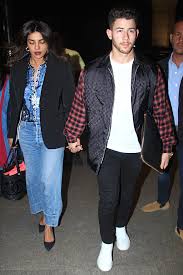 Although they're believed to have met at the 2017 met gala, nick and priyanka's romantic history goes back even further. Priyanka Chopra Flies To New York With Nick Jonas In Comfy Jeans And A Sharp Black Blazer Vogue India