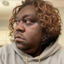 Micah "Katt" Williams is in the 3rd row in the black tie and suit. This was  9th grade at Fairport. I was sent this photo by someone who was there with  him