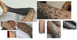 Guy with alphabet tattoo on leg