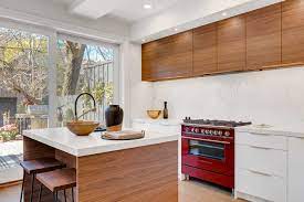 The first or top photo is appealing, perhaps because the wood is on the bottom part of the kitchen and the white fills the upper parts of the kitchen, and it feels fresh. Wood And White Kitchens Oakville Burlington Mississauga