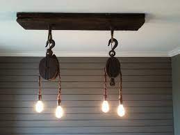 Custom Light Fixture From Vintage Pulleys Ceiling Plate From Reclaimed Wood Www Facebook Com Thetealbutt Custom Light Fixtures Light Fixtures Ceiling Lights