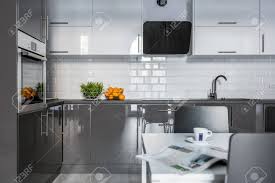 high gloss white and gray cabinets in