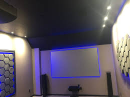 Flat screen installed on masonry wall, with whole home audio system.additionally on the left, a custom home theater room design. About Home Theater Installers In Houston Empire Av