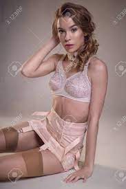 Check spelling or type a new query. Beautiful Woman In Vintage White Lingerie Sitting On Floor Against Grey Background Stock Photo Picture And Royalty Free Image Image 91796678