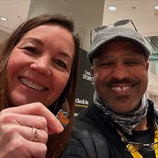 Yay! We're at the National Geographic Storytellers Summit in Washington DC.  The first Joy Trip Project lapel pin goes to Stacey McClain. An avid  listener to the Unhidden Minute Podcast, she was