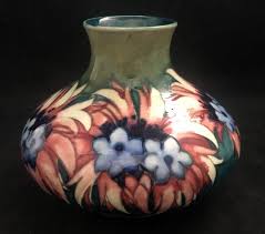 Maybe you would like to learn more about one of these? William Moorcroft Vase Ad Antiques