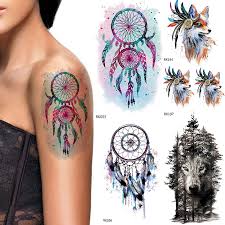 As a form of body painting , temporary tattoos can be drawn, painted, airbrushed, or needled in the same way as permanent tattoos, but with an ink which dissolves in the blood within 6 months. Iorikyo Flash Watercolor Dream Catcher Tattoo Women Arm Stickers Temporary Tattoo Men Jungle Wolf Waterproof Tatoo Windbell Fox Temporary Tattoos Aliexpress
